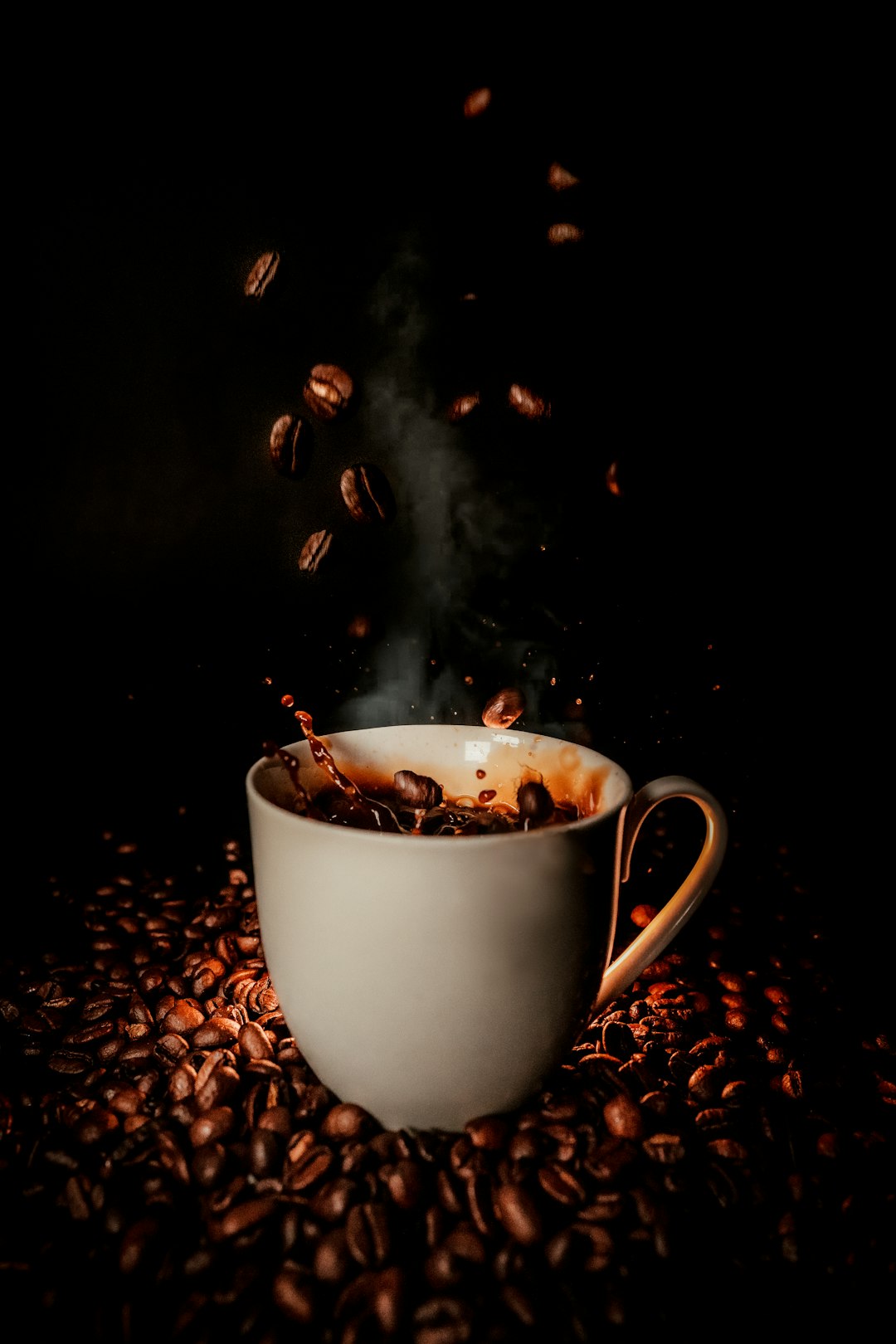 white-ceramic-teacup-with-coffee-beans-lsmu0ruhuok